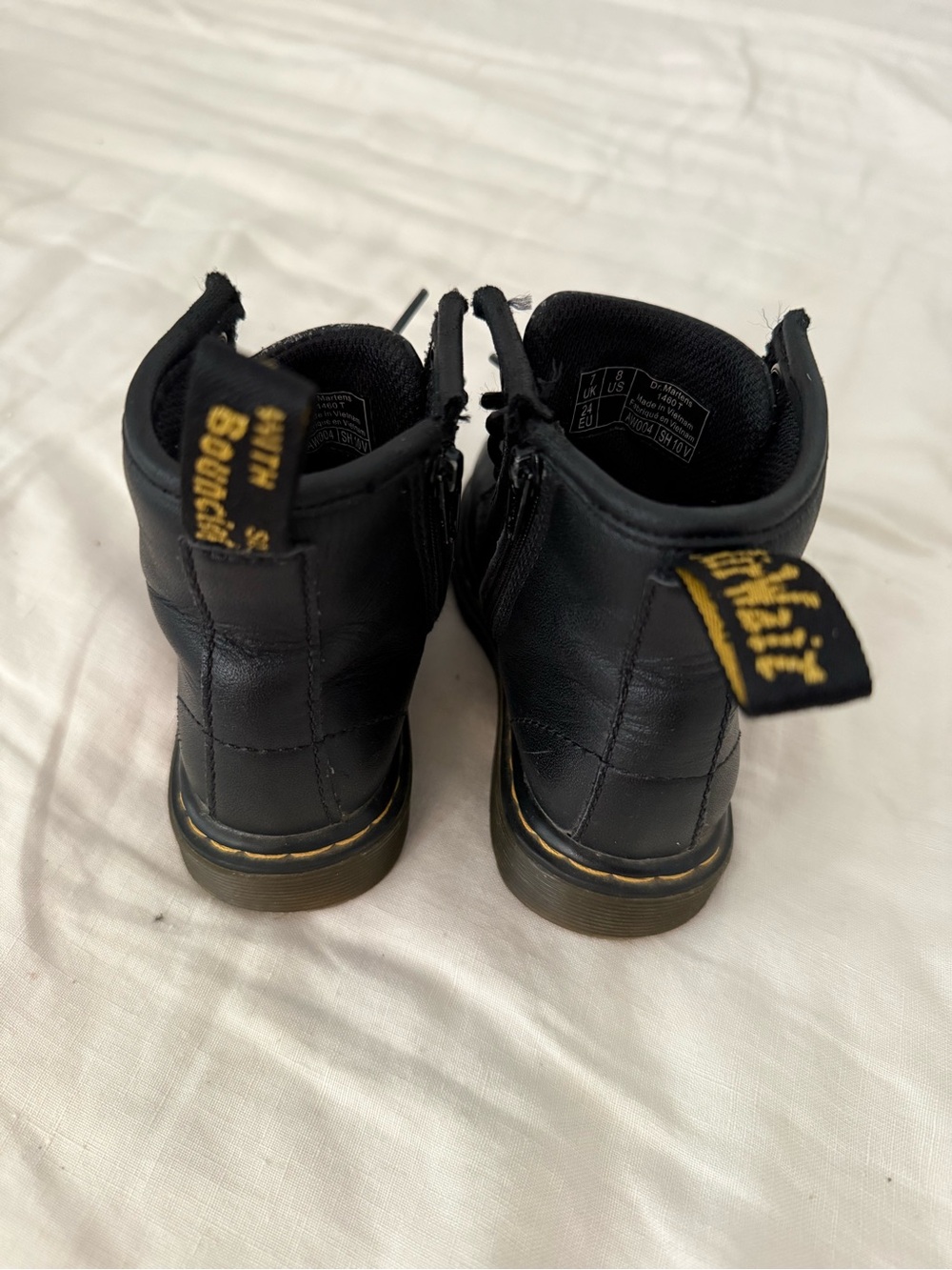Dr. Martens Black Kids Ankle Boots with Yellow Heel Loop